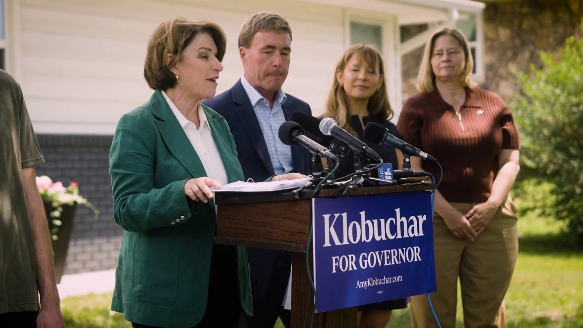 Amy Klobuchar announcing her housing plan at a press conference outside a Minneapolis home